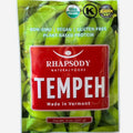Package of Rhapsody Natural Foods Tempeh with green tempeh slices inside.