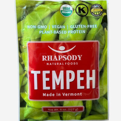 Package of Rhapsody Natural Foods Tempeh with green tempeh slices inside.