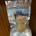 Packaged crab cakes with 'Red's Best Crab Cakes' label on a wooden surface