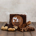 Chocolate Peanut Butter Bar packaging with a visible brand label on a wooden surface.