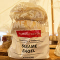 Bagel package with 'Pain d'Avignon' branding on a wooden surface.